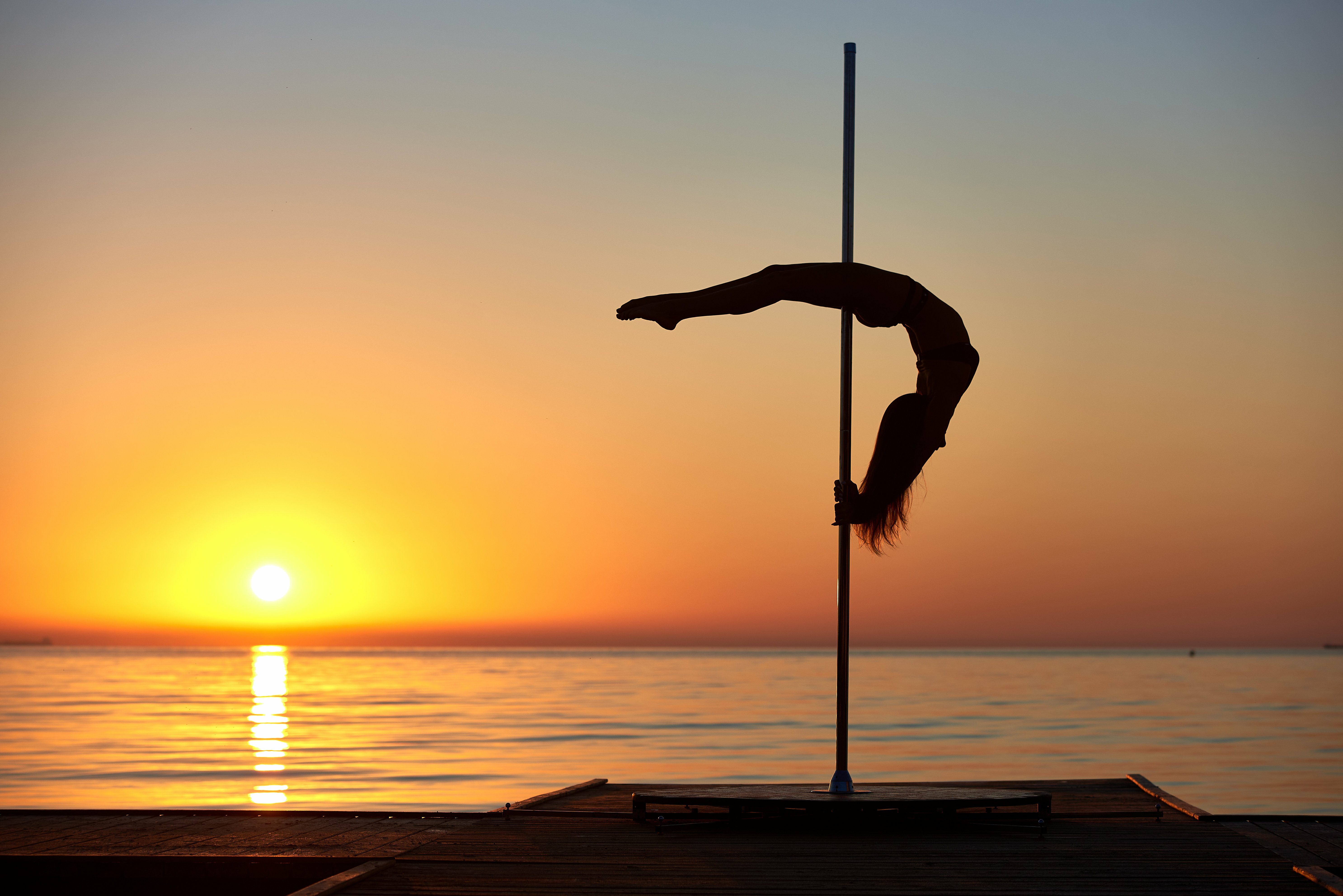 Pole-dancing on the beach